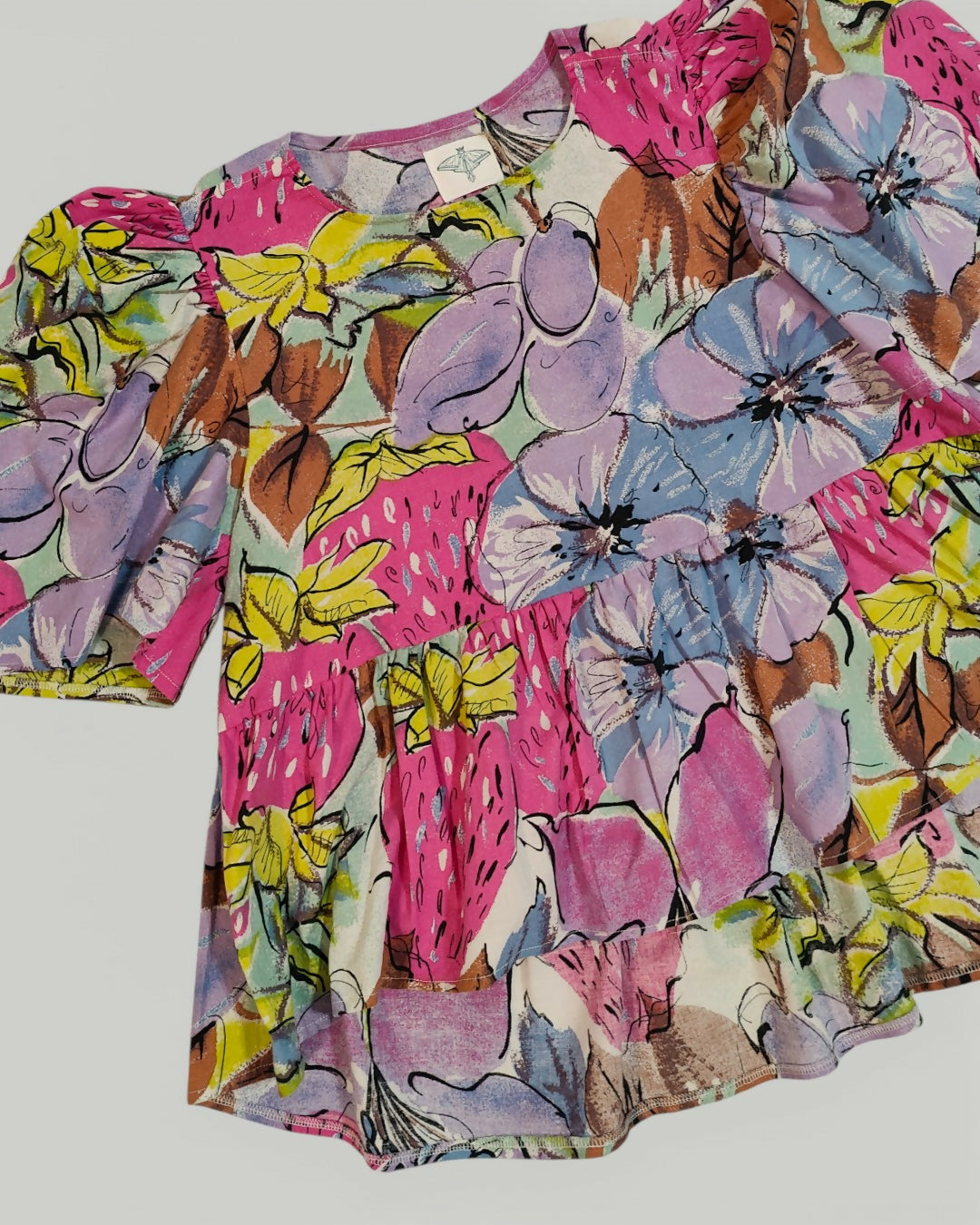 Bufiasta bluzka z przedłużanym tyłem